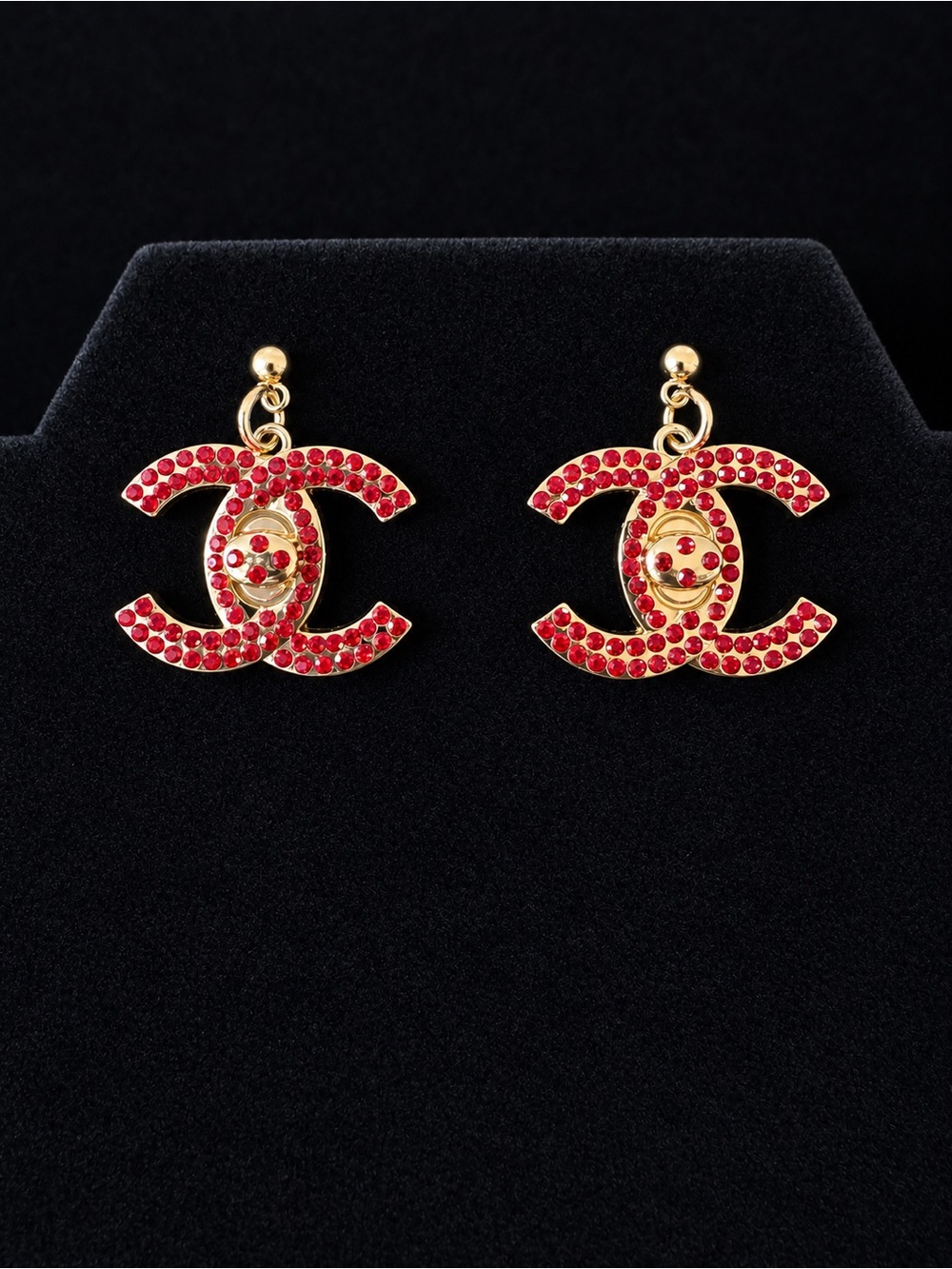 CHANEL Gold-Tone CC Logo Earrings with Red Crystals